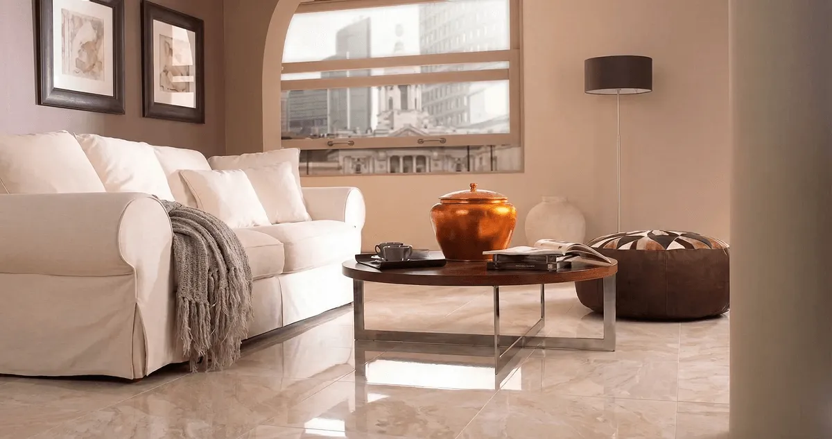 Modern living room with professionally installed marble flooring, a beige sofa, coffee table in Jackson, MS